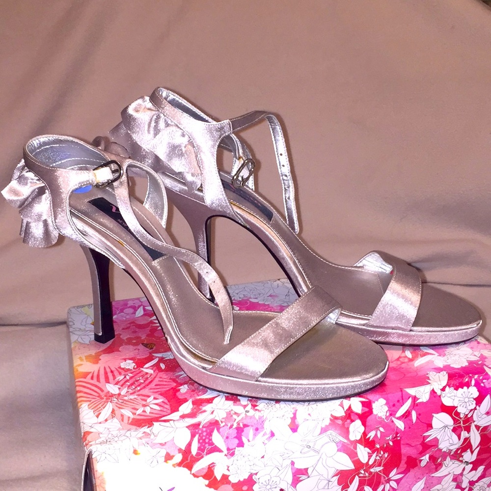 Silver satin 3 1/2 inch strappy heels.